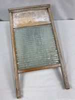 Full view of washboard front showing frame, glass panel, dimensions perspective