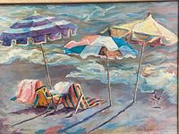 Close view of print showing umbrellas, chairs and waves