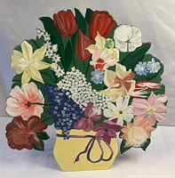Front of shaped wooden plaque showing painted floral bouquet in yellow pot