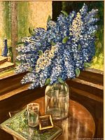 Close-up of flower arrangement and tabletop objects