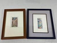 Both framed prints side by side