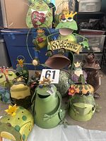 Group shot of all metal frog garden items