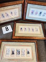 Four framed sets of Cope's Golfers cards displayed together