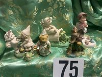 Group view of six assorted figurines
