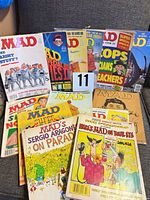 All magazines and books laid out on sofa showing covers