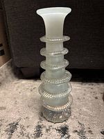 Full view of tiered uranium glass vase upright