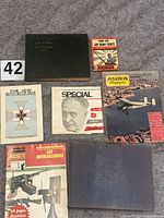 All eight publications laid out face up