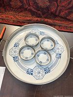 Top view of tray with four coasters placed on surface