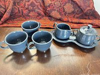Full set: three cups, creamer, covered sugar bowl on tray