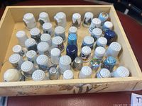 Tray containing entire group of thimbles