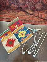 Group shot showing all four coasters, beaded steer ornament and three necklaces