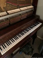 Full keyboard and cabinet showing Ahlstrom nameplate