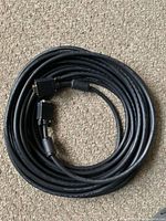 Coiled 50-foot VGA cable showing both connectors and ferrite core