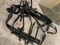 Overall view of folded SportRack bike rack showing frame and straps