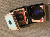 Two open boxes filled with 78 RPM shellac records, sleeves visible
