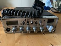 Front view showing Cobra 29XLR faceplate, controls, missing Dynamic knob, attached microphone