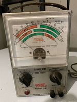 Front view showing EICO Model 944 tester with meter, knobs and terminals