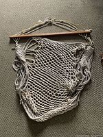 Full view of rope hammock chair with spreader bar and hanging hardware