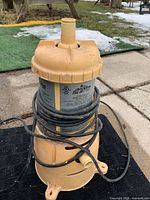 Full view of beige pool filter with cord