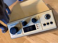 Front view showing controls, display, mic jack