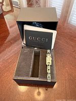 Watch in open Gucci box with booklet and COA