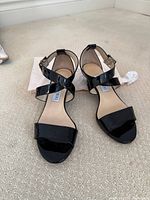 Front view of both sandals with dust bag