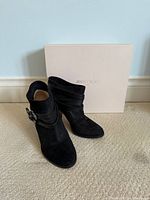 Boot pair front view with box behind