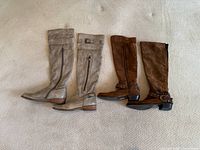 Both pairs of knee-high boots side by side
