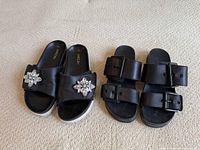 Both pairs of sandals side by side for overall view