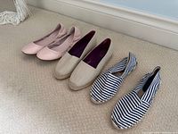 Three pairs of women’s slip-on shoes arranged side by side