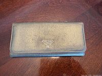 Front view of Prada Saffiano leather wallet closed