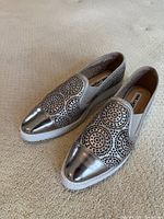 Top angle view of both shoes showing perforated design and cap toes