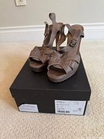 Sandals on top of box, showing overall design and style