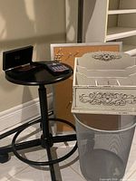 All items grouped: stool/stand with calculator and organizer on top, cork board, letter sorter, wastebasket