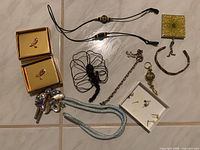 All jewellery items laid out on tile floor