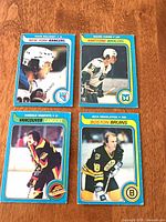 All four 1979-80 OPC hockey cards laid out on table