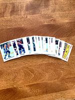 Fan of 1987 OPC mini hockey cards spread on table