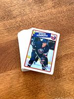 Stack of O-Pee-Chee hockey cards, top card Steve Konroyd NY Islanders