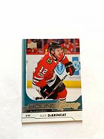 Front of Alex DeBrincat Young Guns rookie card