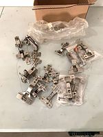 Box with loose and bagged concealed cabinet hinges and plates