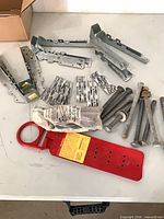 Overall lot showing roof anchor, bolts, hangers, brackets, nails