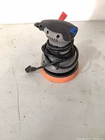 Full view of buffer polisher with cord and foam pad