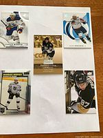 Overview of five hockey cards laid out on white background