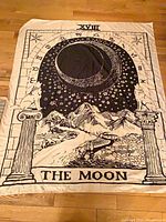 Tarot card The Moon tapestry laid flat