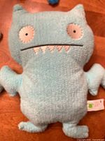Large light blue Uglydoll plush front view