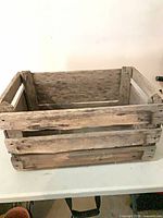 Full view of wooden slat crate, open top