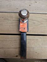 Top view showing chrome ball, label on shank