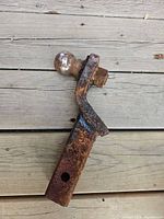 Side view of drop hitch showing integrated ball and rust