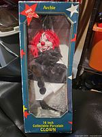 Front of boxed 16" Archie porcelain clown doll
