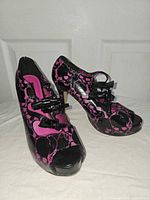 Both shoes angled side view showing pattern and style